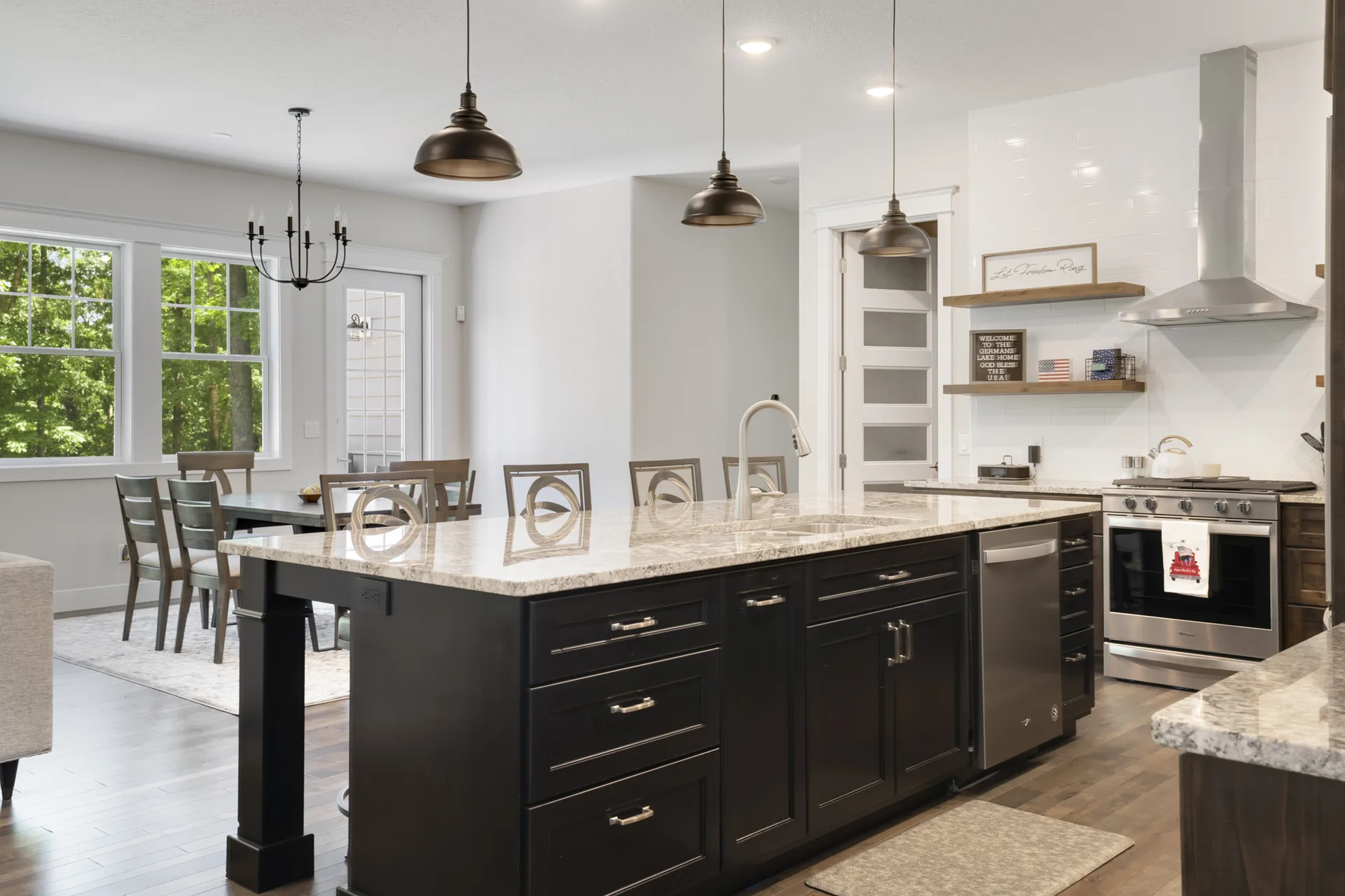 Custom kitchen with island and barstools by Cloke Custom Homes